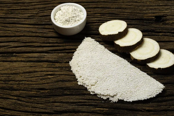 Beiju of tapioca, cassava-based dish typical of the northeastern region of Brazil, now consumed in the whole country on old wooden background.