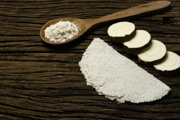 Beiju of tapioca, cassava-based dish typical of the northeastern region of Brazil, now consumed in the whole country on old wooden background.