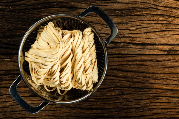 Semolina Pasta Eggs Noodles Water Drainer Aged Wood Background — Stock Photo, Image