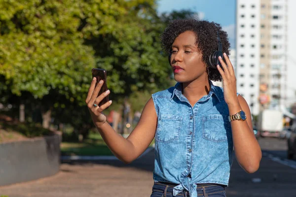 Young listening to music during city tour.