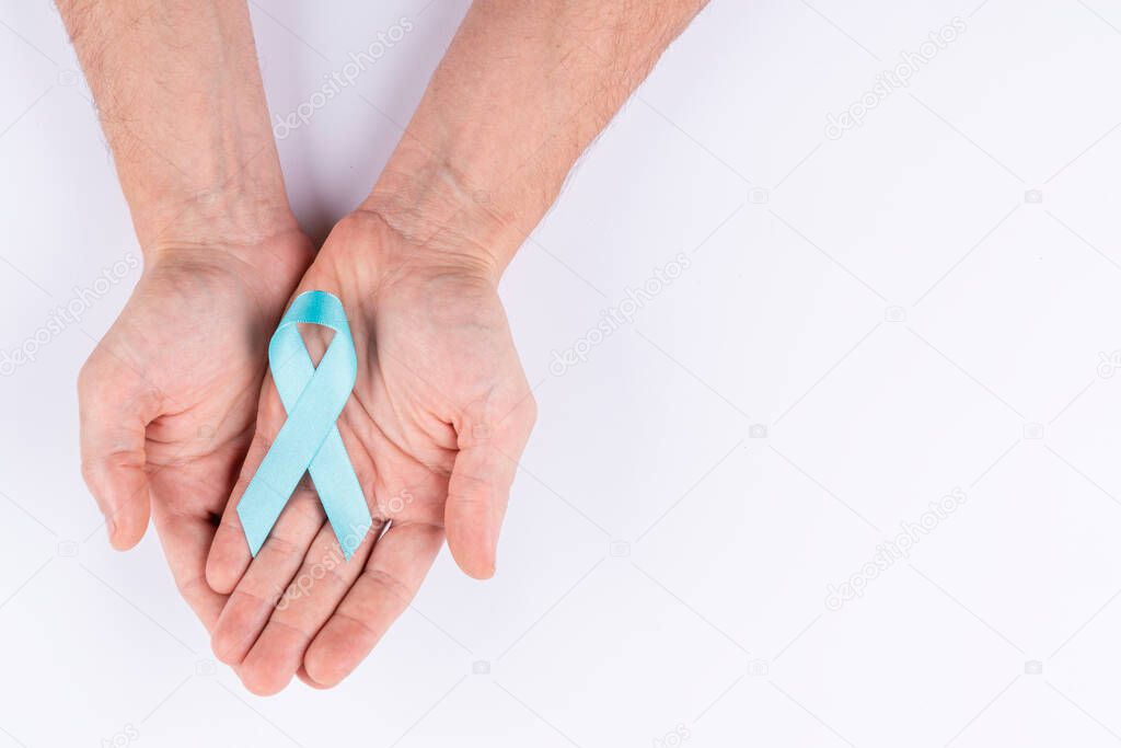Hands holding cyan ribbon. White background.