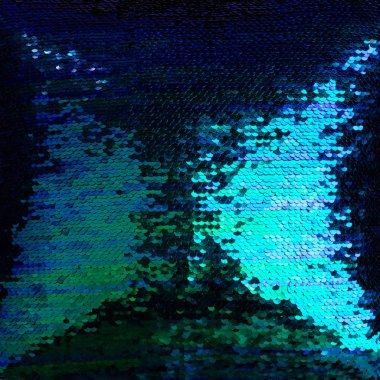 Yeşil, mavi ve mor payetlerin arka planı