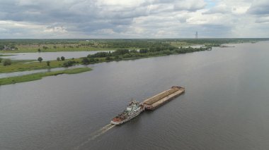 Barge on the river Volga clipart