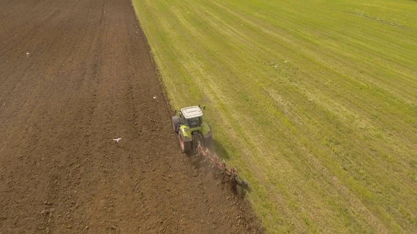 Tractor plowing a field.Aerial video.