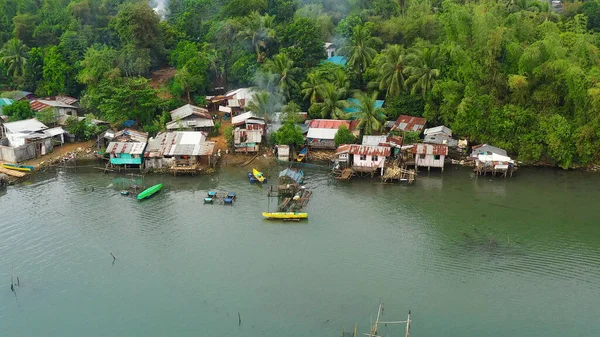 Fishing village and houses on stilts. Luzon, Philippines. — Stock Image Fishing village and houses on stilts. Luzon, Philippines. Stock Photo
