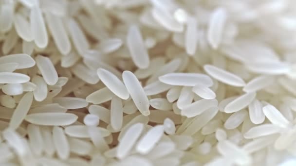 Filmagem 4K de arroz branco não cozido de close-up extremo rotativo . — Vídeo de Stock