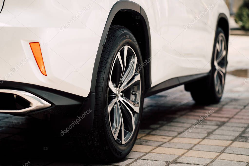 Close up photo of modern luxury sport car suv elegant design mufflers tailpipe.