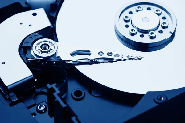 Closeup macro photo of head in opened hard disk drive. Concept of repair or recovery information from broken HDD. — Stock Photo, Image