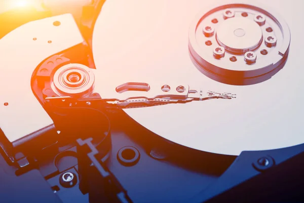 Closeup macro photo of head in opened hard disk drive. Concept of repair or recovery information from broken HDD. — Stock Photo, Image