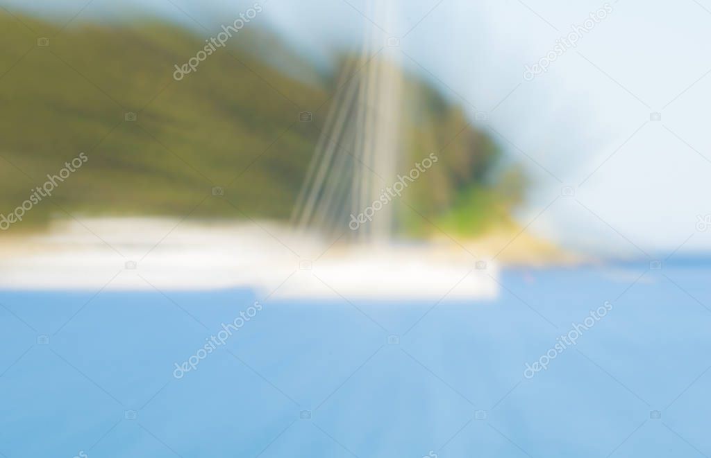 Background image abstract zoom blur at beach with hint of morred yacht