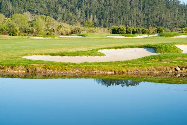 Sand-traps and blue pond — Stock Photo, Image