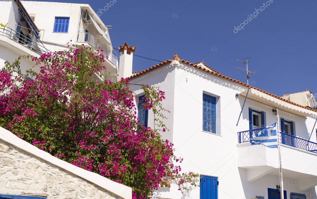 Typical white walls and blue windows of Greek Mediterranean buil