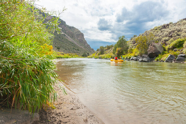 New Mexico USA - September 16 2015;  People getting into inflatable boat to paddle Rio Grande river New Mexico, USA.