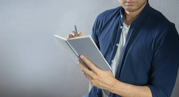 Man Writing Notebook Grey Background — Stock Photo, Image
