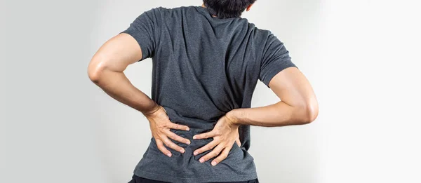 Lower back pain - Man pressing back