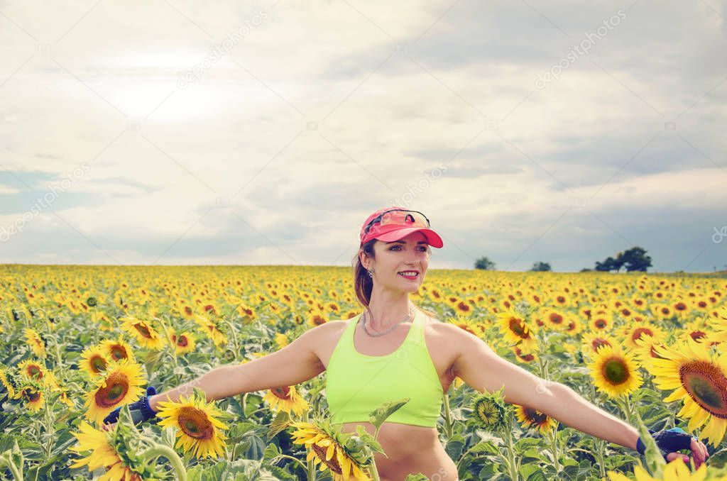girl on the field with a sunflower