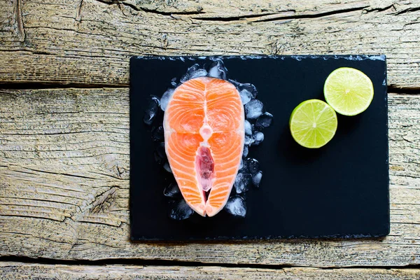 Salmon Steaks Lime Ice Black Wooden Table Top View Fish — Stock Photo, Image