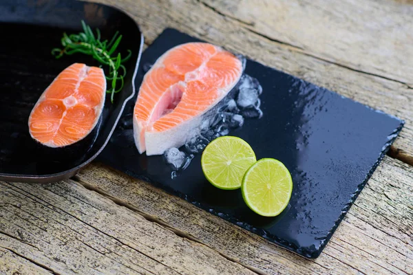 Two Salmon Steaks Ready Cook Grill Lime Wooden Background Top — Stock Photo, Image