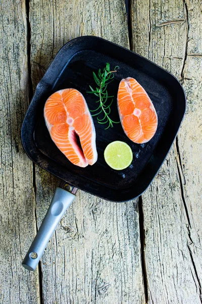 Two Salmon Steaks Ready Cook Grill Lime Wooden Background Top — Stock Photo, Image