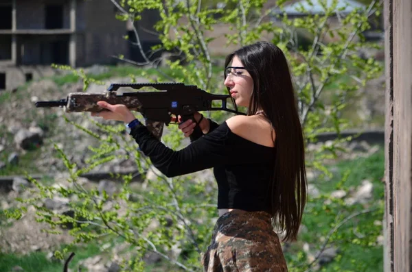 Airsoft game beautiful Girl With Gun.Nice and danger