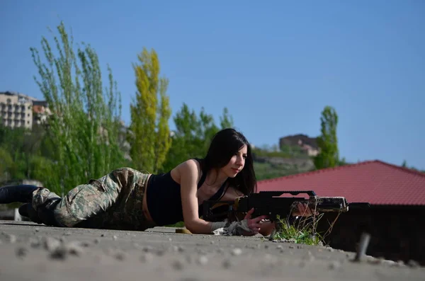 Airsoft game beautiful Girl With Gun.Nice and danger