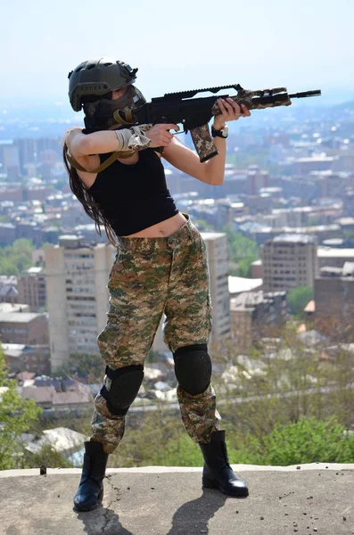 Airsoft game beautiful Girl With Gun.Nice and danger