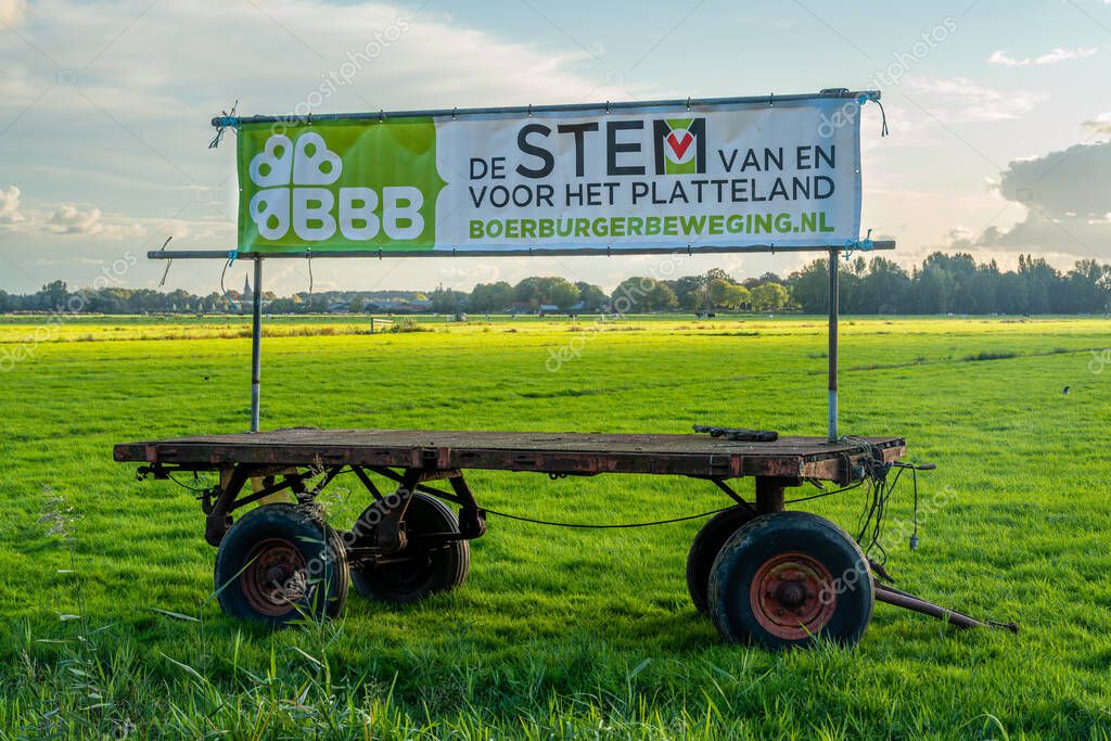 Amsterdam, The Netherlands, 23.09.2025, Election campaign banner of Dutch Farmer-Citizen Movement Political Party (BoerBurgerBeweging, BBB) displayed on a farming trailer in a grassland