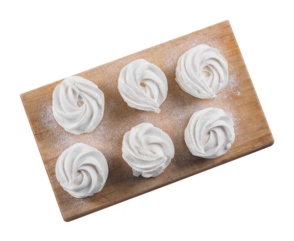 Ahşap tahta üzerinde beyaz ev yapımı zephyr. izole arka plan.