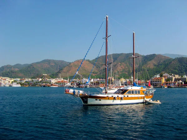 Pleasure yacht out of port to the open sea. — Stock Photo, Image