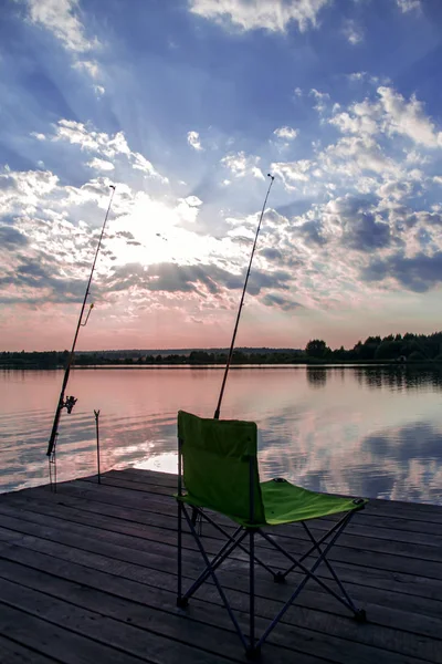 Folding chair and fishing rod on Lake