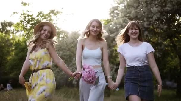 Women Friendship Three Attractive Girls Summer Outfits Holding Hands Together — Stock Video