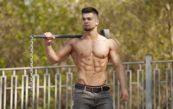 Young Man Hits Tire - Workout Outdoors With Hammer