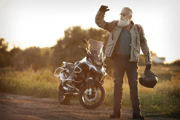 Portrait of a senior man outdoors. Old biker portrait.