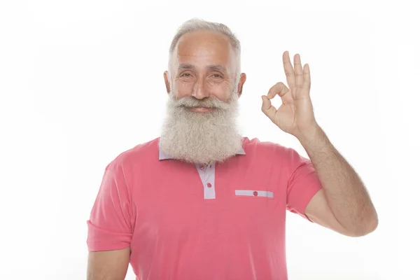 Senior Divertido Barbudo Hombre Rosa Camiseta Muestra Gestos Muecas —  Fotos de Stock