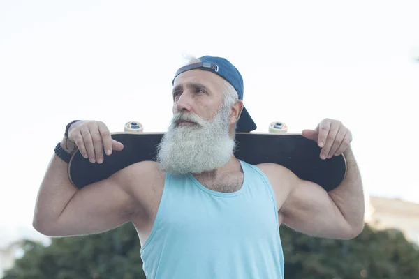 Energetic Senior Man Enjoying Riding Skateboard — Stock Photo, Image