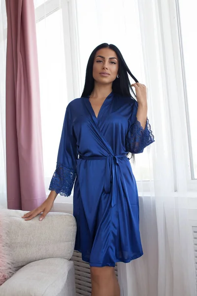 Beautiful sexy woman wear silk pajama style casual girl with dark hair fashion catalog lady perfect face cosmetic and body makeup meeting walk interior room.