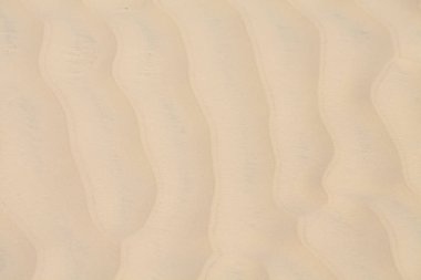 Sahilde kum, arka plan olarak