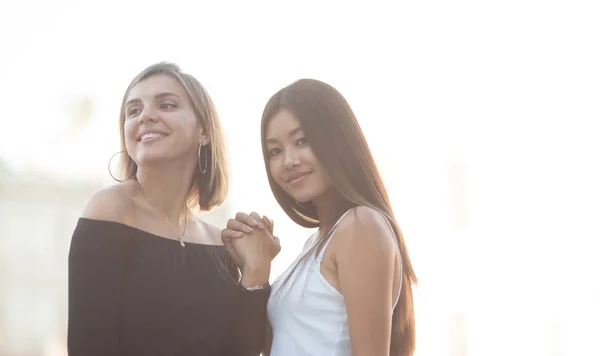 Two Young Women Hugging Outdoors Asian Girl Looking Camera Smiling — Stock Photo, Image