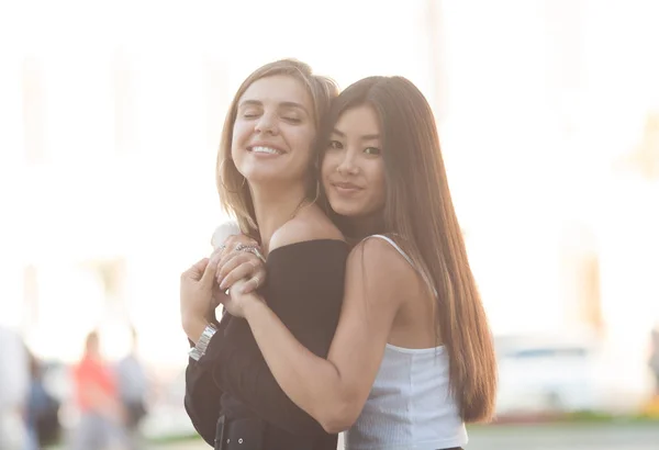 Two Young Women Hugging Outdoors Asian Girl Looking Camera Smiling — Stock Photo, Image