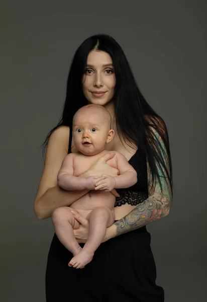 Mother Holds Baby Her Arms Grey Background — Stock Photo, Image