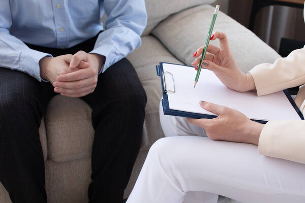 Psychologist having session with her patient in her private consulting room.