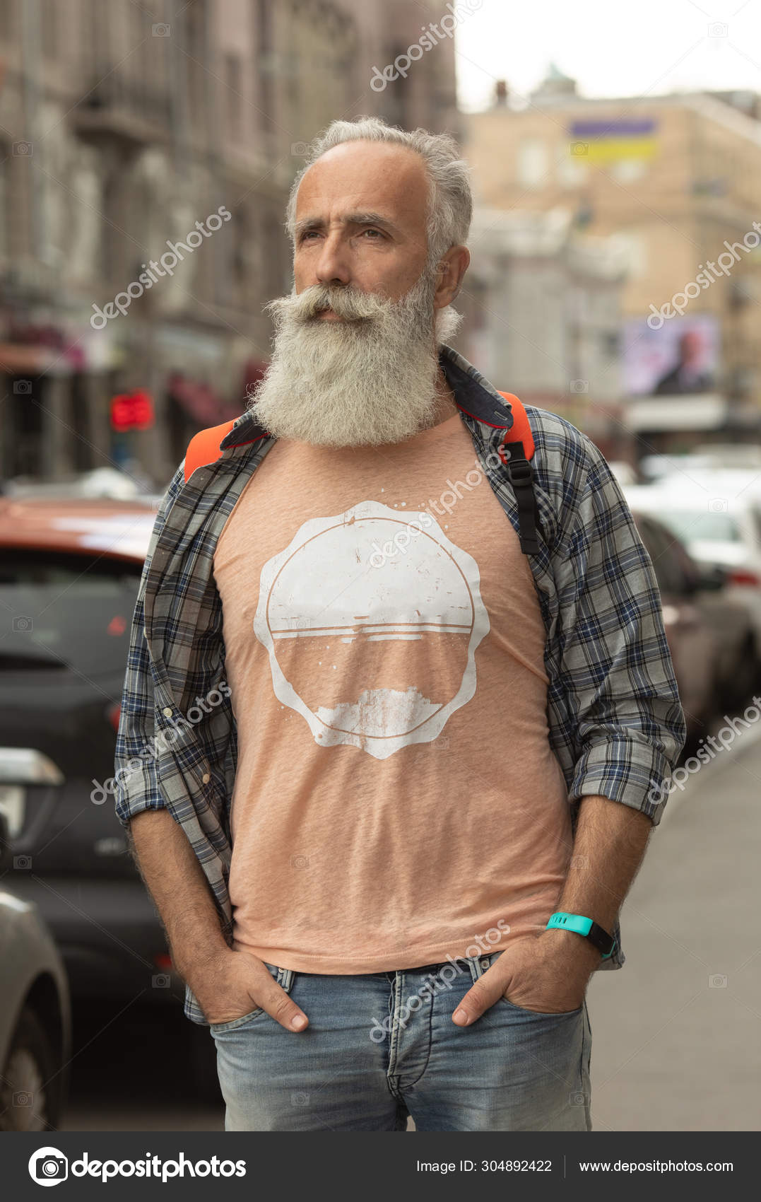 Mature hipster with beard. Bearded man walking on street. modern