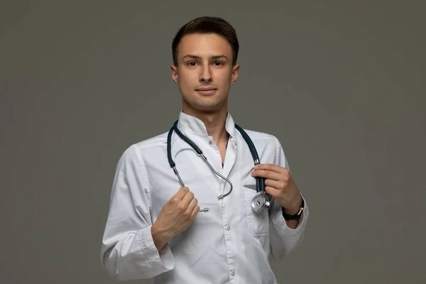 Portrait Handsome Doctor White Coat Looking Camera Isolated Grey Background — Stock Photo, Image