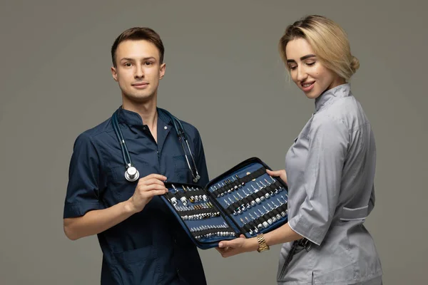 Two Doctors Holding Ampoules Vaccines Grey Background Closeup Medical Objects — Stock Photo, Image