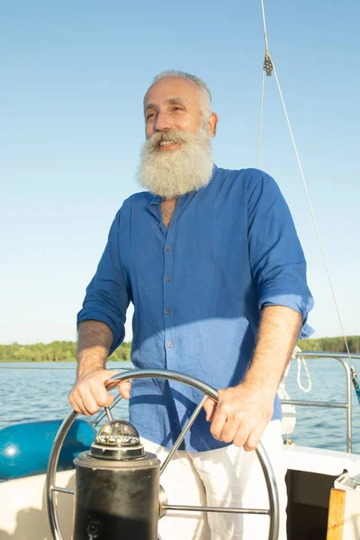 Mature Bearded Man Standing Helm Yacht Out Lake Steering Smiling — Stock Photo, Image