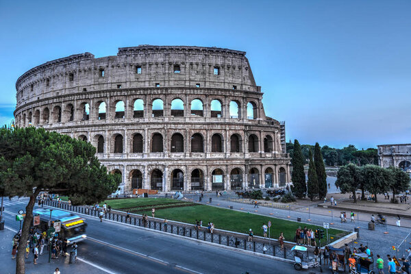 A view of Colloseum and city traffic at summer time Rome Italy