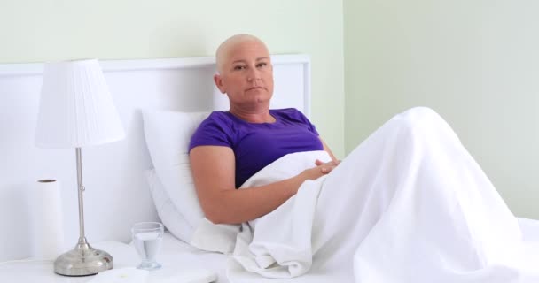 Bored Female Cancer Patient Laying Bed Looking Camera — Stock Video