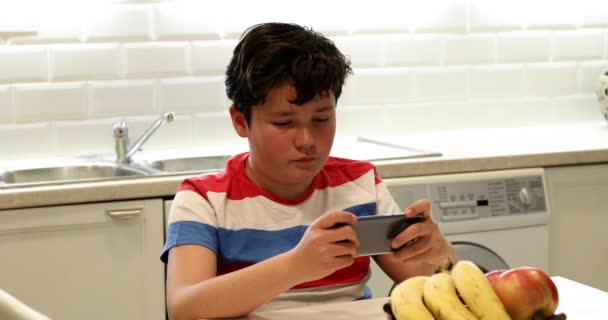 Portrait Relaxed Preteen Boy Sitting Kitchen Digital Tablet Computer Texting — Stock Video