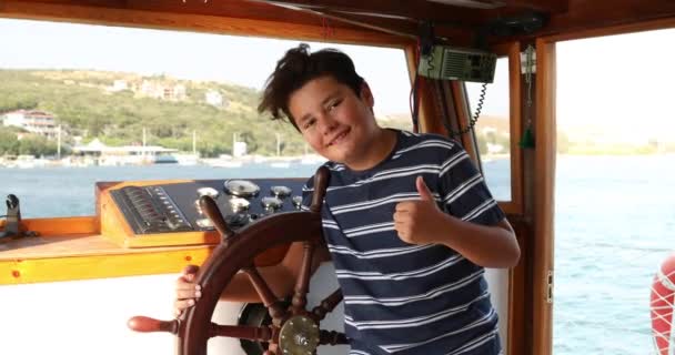 Handsome young sailor at the helm 2 — Stock Video