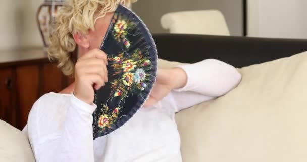 Portrait Middle Aged Woman Suffering Heat Wave Using Fan Sitting — Stock Video